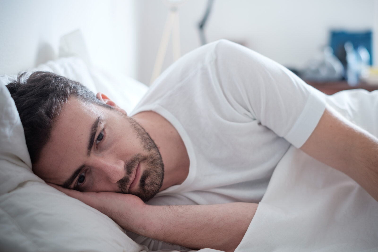 Man awake suffering from Snoring and Sleeping Disorders