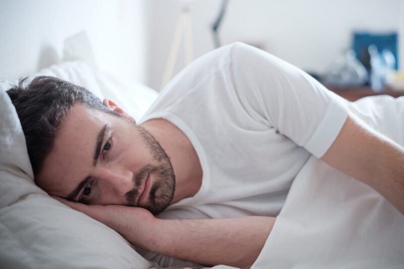 Man awake suffering from a Snoring and Sleeping Disorders