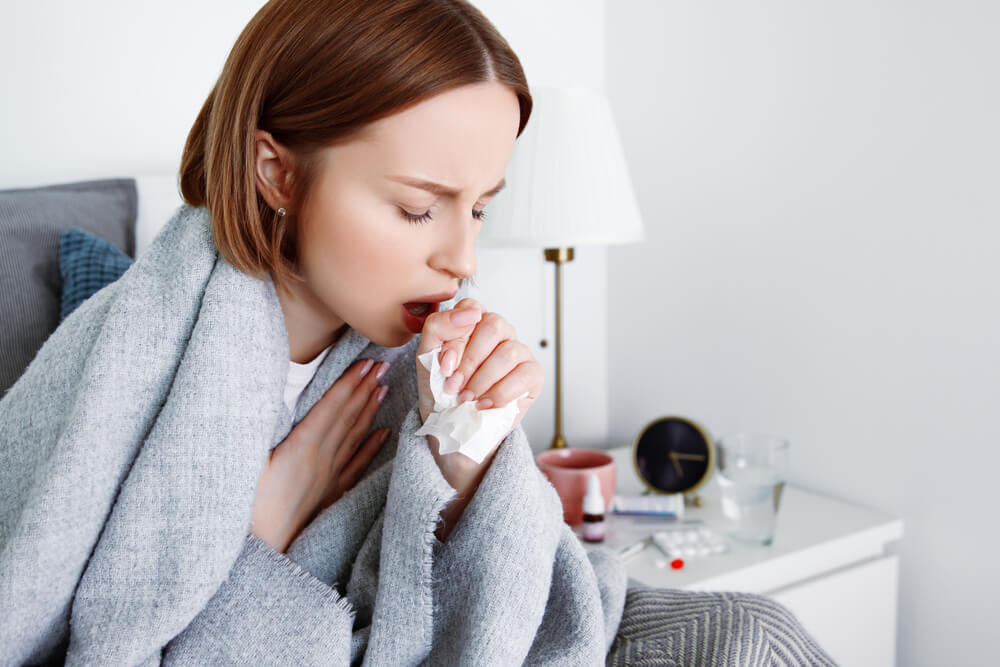 Sick woman suffering from cold