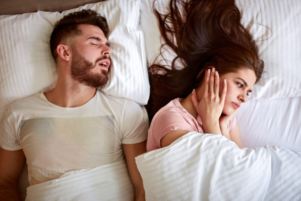 Young couple have problem with man's snoring