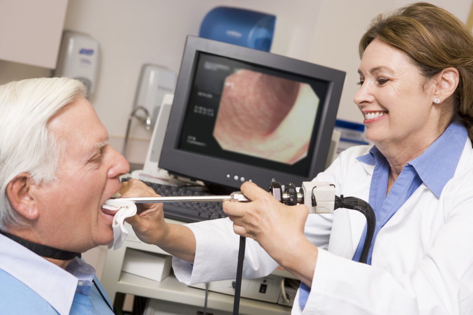 doctor using a small scope to see the throat
