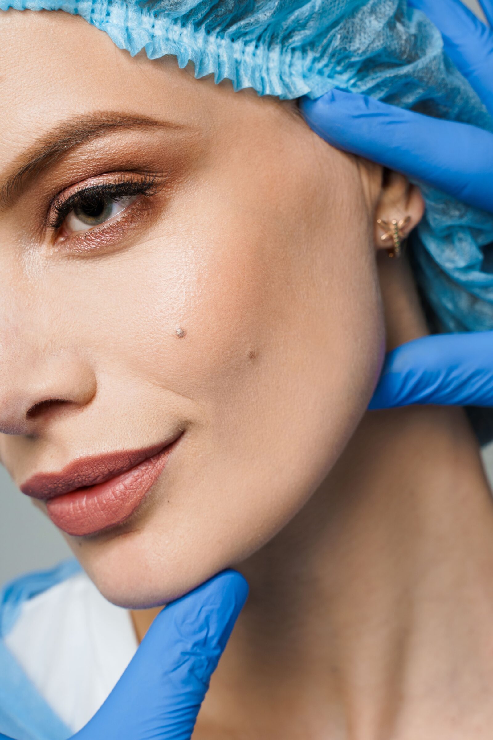 woman with nice skin in a surgical hat